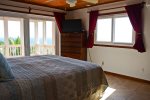 Master bedroom on the ground floor opens onto the main deck and enjoys the same stunning sea views.